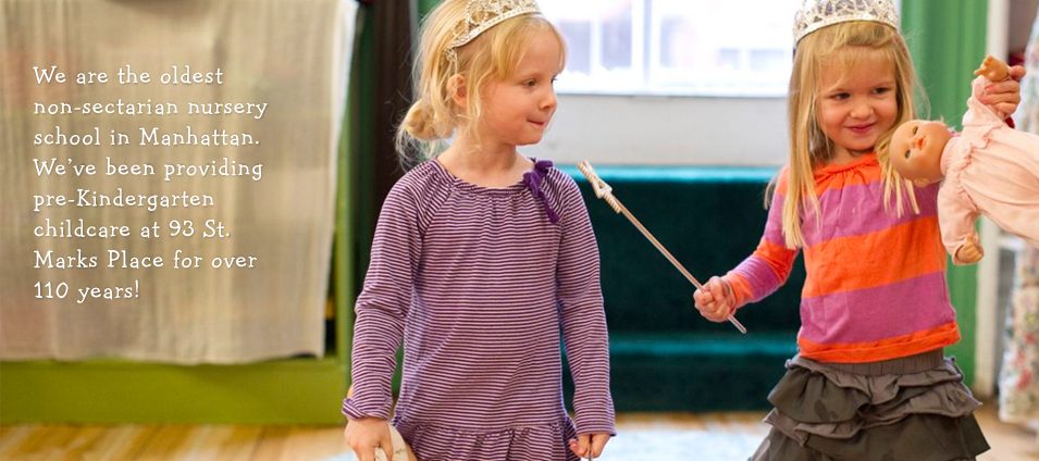 We are the oldest non-sectarian nursery school in Manhattan, at 93 St. Marks Place. Two girls in tiaras play dress-up with a wand and a doll.